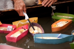Lighting the Candles on the Little Boats.